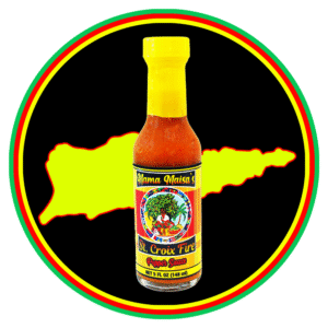 A bottle of hot sauce with a vibrant label and yellow cap, set against an island silhouette.