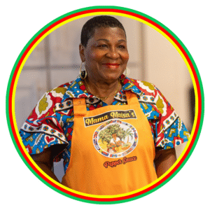 Smiling woman in colorful attire and apron, standing confidently.